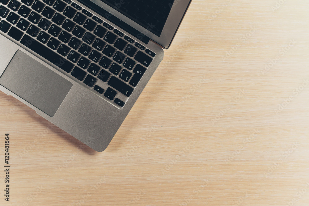 Laptop keyboard on the wooden desk Laptop keyboard on the wooden desk