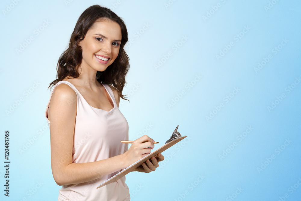 Happy smiling young beautiful woman with clipboard Happy smiling young beautiful woman with clipboard