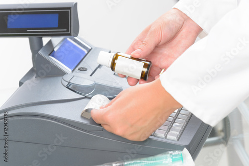 pharmacist using cash register