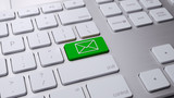 Green email button on white keyboard 3 d render