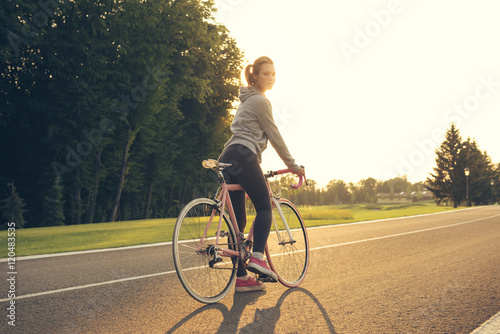 Active woman riding a bicycle