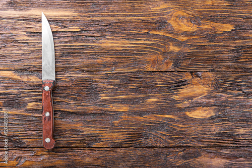 Knife on a wooden board