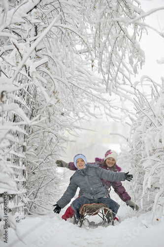 kids sit on sled