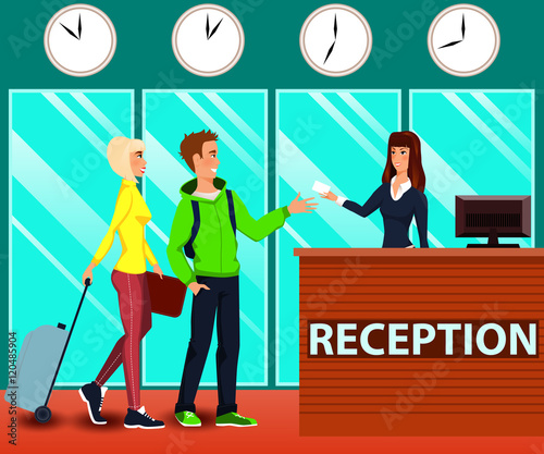 Guests are receiving the access card for the room at the hotel's reception