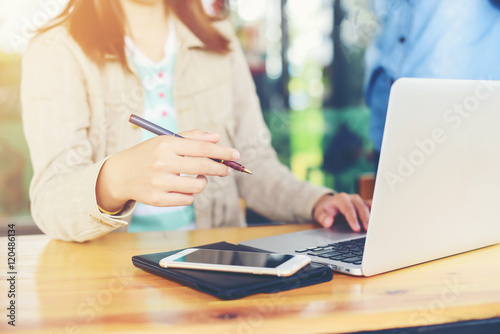 Woman worker of happy with  notebook and phone