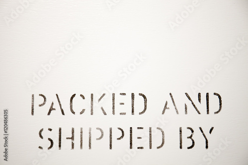 Packed and Shipped by lettering on box