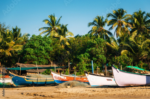 Wooden fishing boats on Morjim beach, North Goa, India