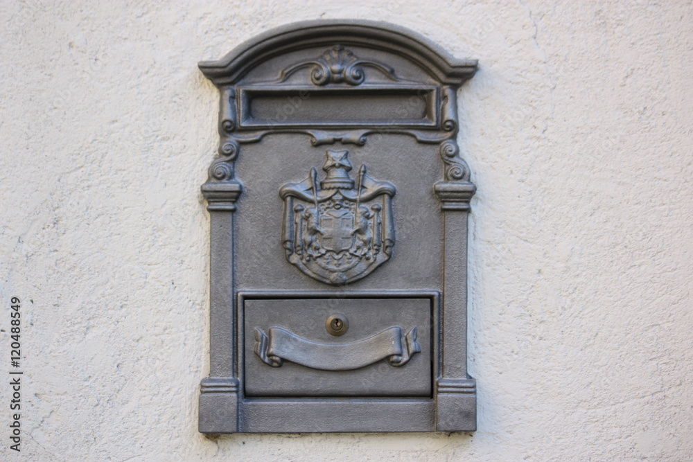 Letterbox on gray house wall 