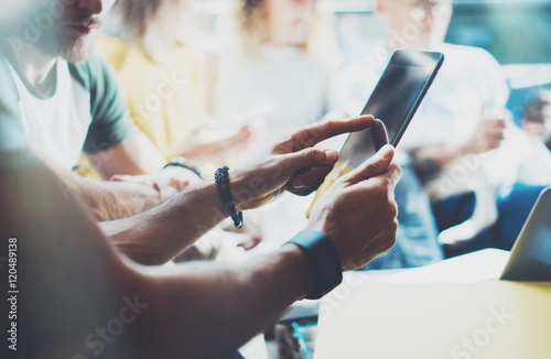 Closeup Bearded Man Using Modern Tablet Hand.Hipster Making Great Business Idea.Coworker People Professional Gathered Together Decision Corporate Work.Startup Creative Presentation Concept Blurred