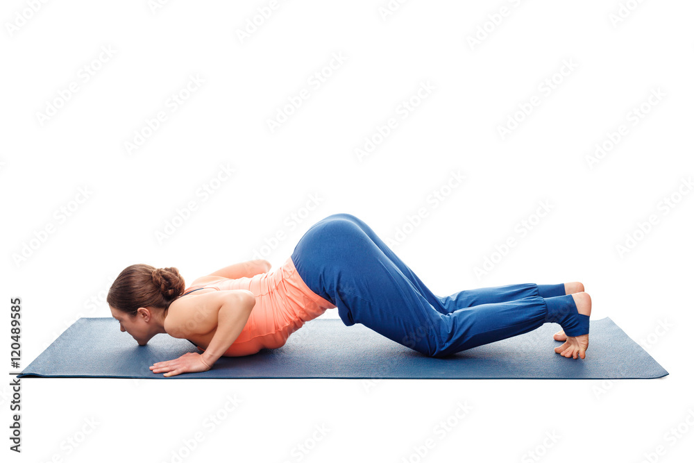 Woman doing yoga asana Ashtangasana isolated on white Woman doing yoga asana Ashtangasana isolated on white