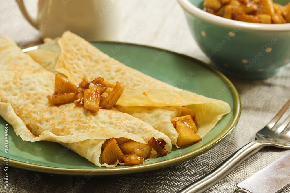 Apple Crepes / Crepes with Caramel apple filling, selective focus Apple Crepes / Crepes with Caramel apple filling, selective focus