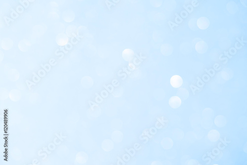 Unfocused abstract light blue glitter bokeh holiday background. Winter xmas holidays. Christmas. © elenabdesign