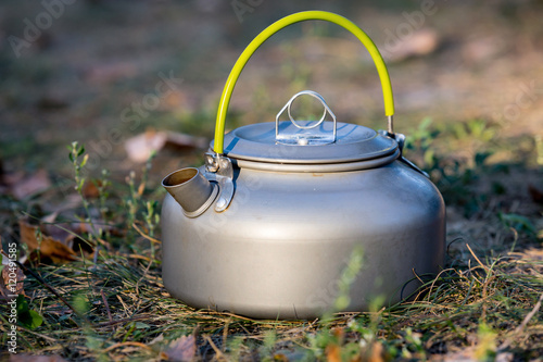 tourist kettle in grass