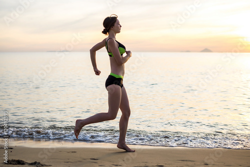 Woman Running on the Beach at Sunset