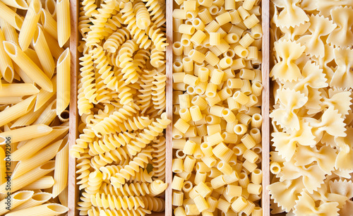 Various types of dry pasta of different shapes