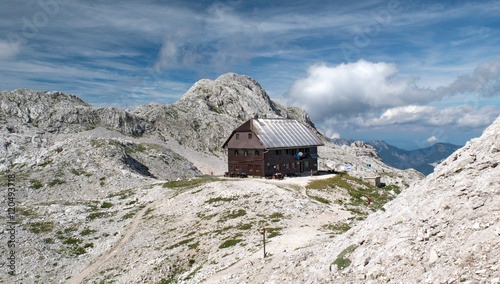 Dom Valentina Stanica mountain hut with Vrbanova spica mountain in Julian Alps in Slovenia