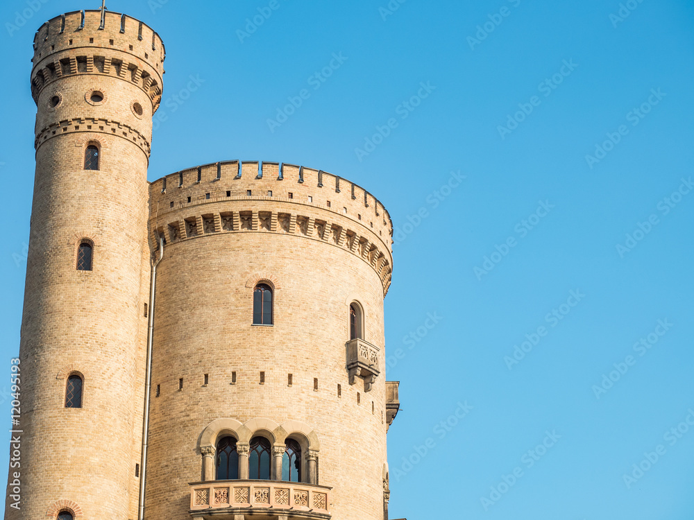 Gothic tower on a clear sky background