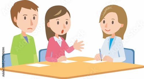 Doctor meeting couple in hospital office