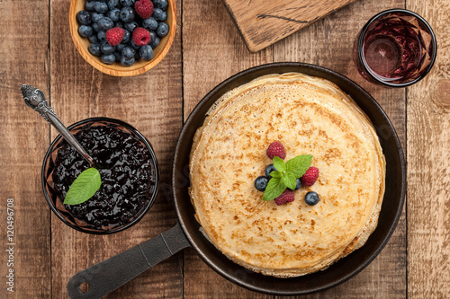 Crepes with fresh berries and jam