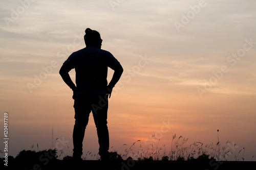 Silhouette man with beautiful the sky at sunset..Background,