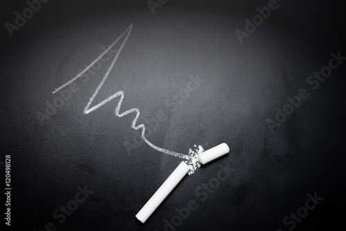 wavy-line-and-broken-chalk-stick-on-blackboard-focus-on-chalk-fa