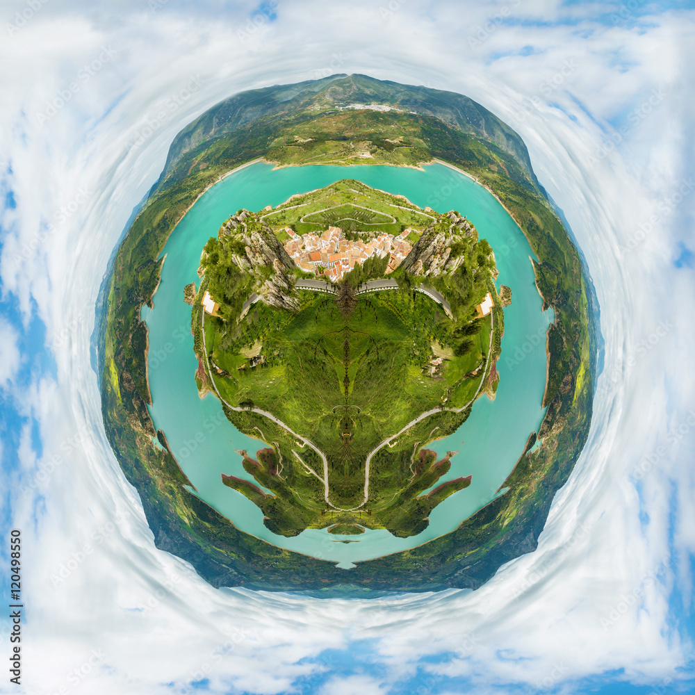 Fototapeta premium Little planet composition of an aerial view of the top of a green earth with trees and seas, in a cloudy blue sky. Concept of green ecosystem conservation.