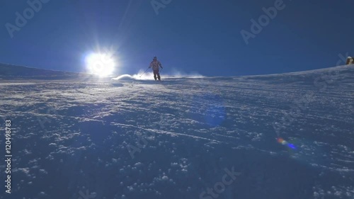 WS HD Slow-Mo: Man Skiing Downhill and Spray Snow ON Sunny Day
