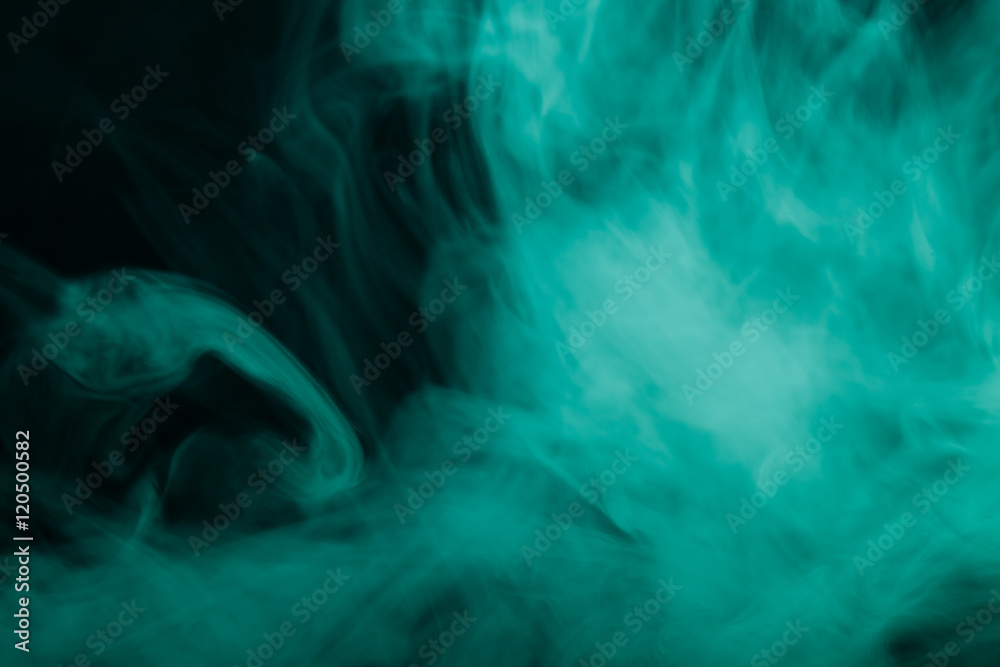 Cloud of smoke on black background. Selective focus. Toned Cloud of smoke on black background. Selective focus. Toned