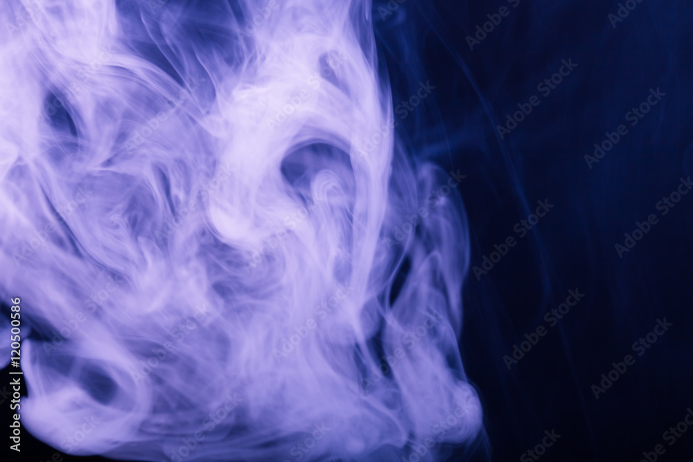 Cloud of smoke on black background. Selective focus. Toned Cloud of smoke on black background. Selective focus. Toned