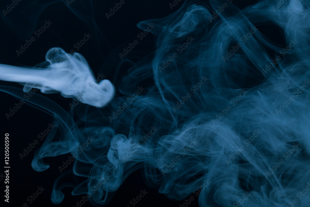 Cloud of smoke on black background. Selective focus. Toned Cloud of smoke on black background. Selective focus. Toned