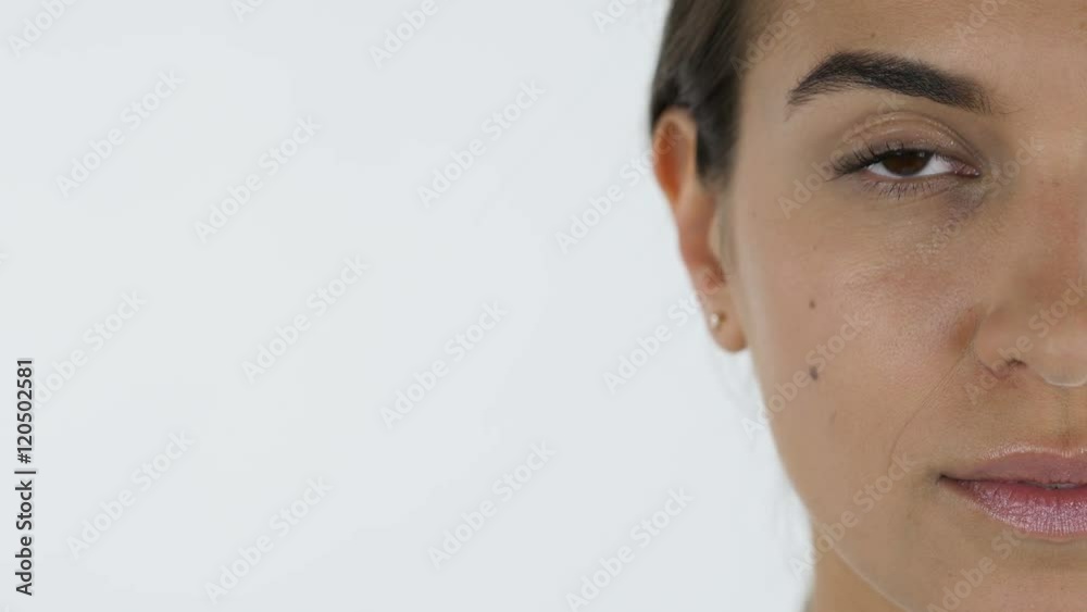 Close up of Beautiful Girl Face, White Background in Studio Close up of Beautiful Girl Face, White Background in Studio