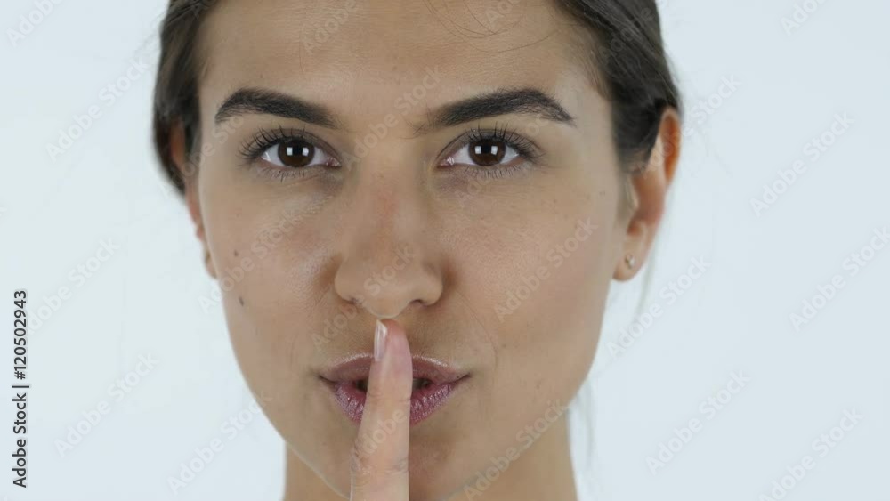 Silence Gesture, Close up of Girl, White Background in Studio Silence Gesture, Close up of Girl, White Background in Studio