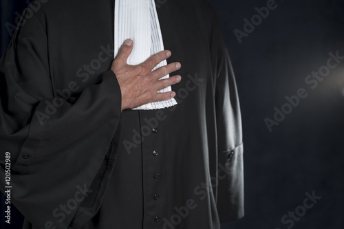 Lawyer in gown with jabot hands close up judge