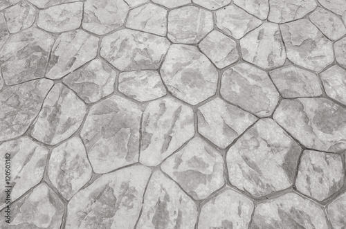 Closeup surface brick pattern at old red stone brick floor at pathway texture background in black and white tone