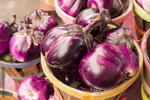 Large round purple eggplants at the market