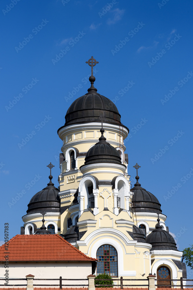 Photo of Capriana Monastery in Moldova with blue sky