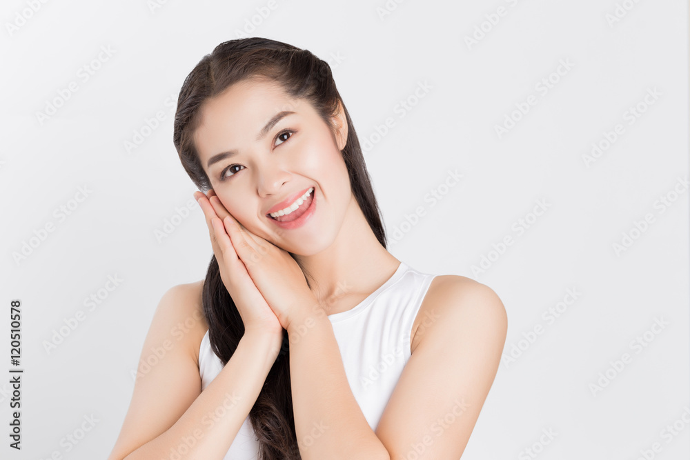 Young Asian woman looking upward with smiley happy face. Young Asian woman looking upward with smiley happy face.