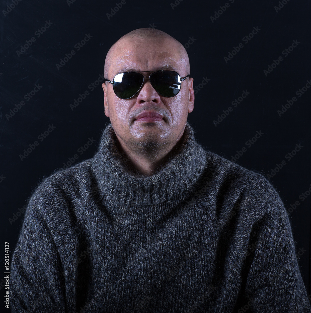 studio portrait of a bald man with glasses studio portrait of a bald man with glasses
