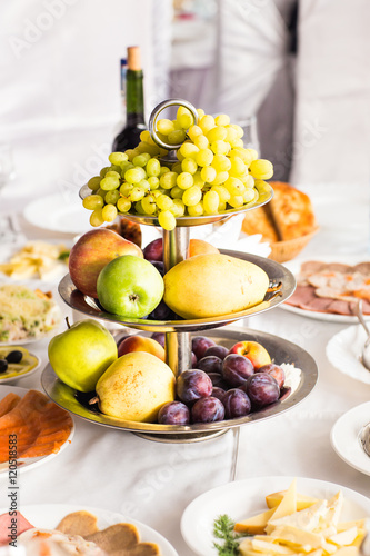 Plate full of fresh fruits on a festive table