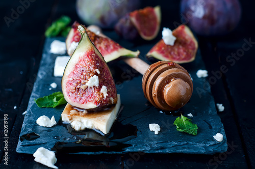 Appetizer of figs and cheese with honey. photo