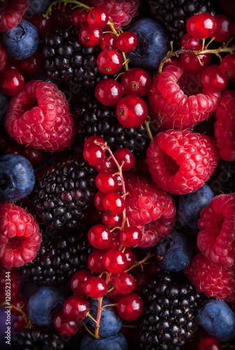 Berries assorted mix in studio on dark background