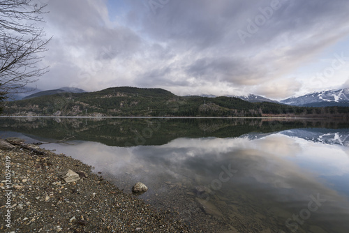 View of calm lake with mountains, Whistler, British Columbia, Ca