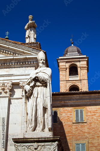 Urbino Cathedral. It was ornamented with five statues, representing three theological virtues of Faith, Hope, and Charity, between Saint Augustine to the left and Saint John Chrysostom to the right. photo