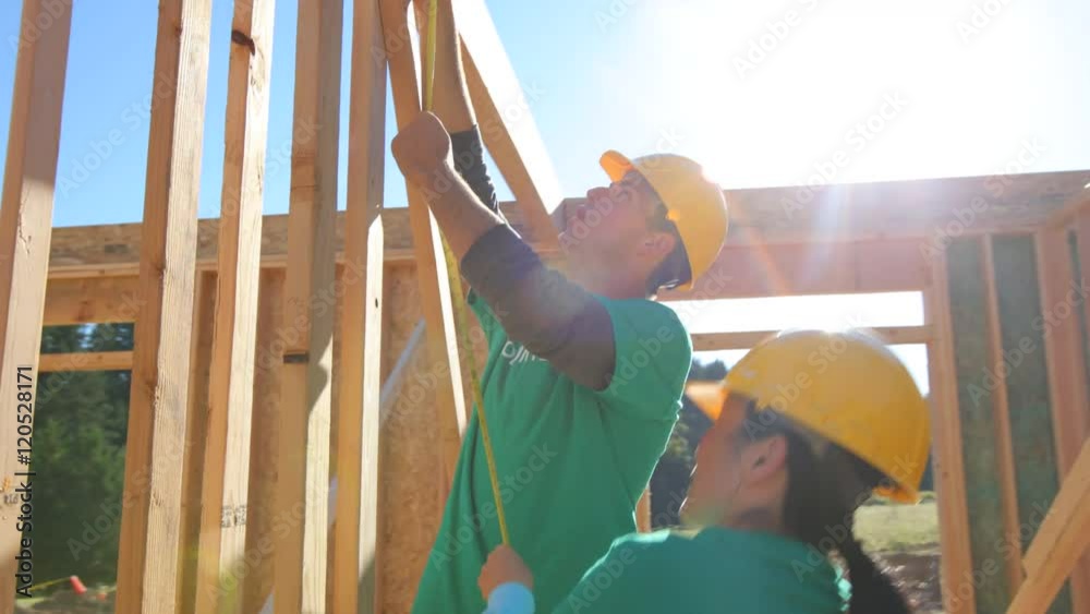 Volunteers working together on construction project