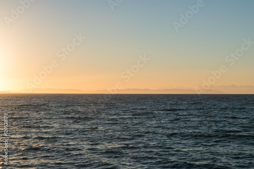 sun rising over mediterranean sea coast