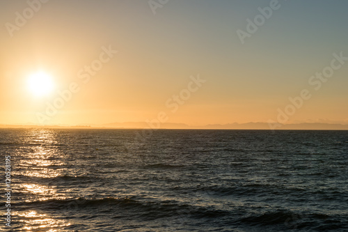 sun rising over mediterranean sea coast