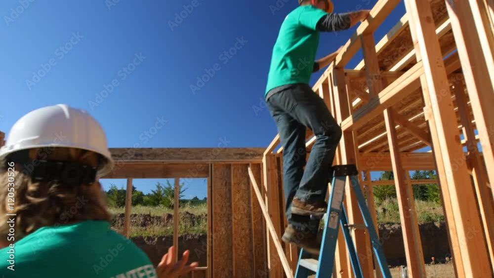 Volunteers working together on construction project