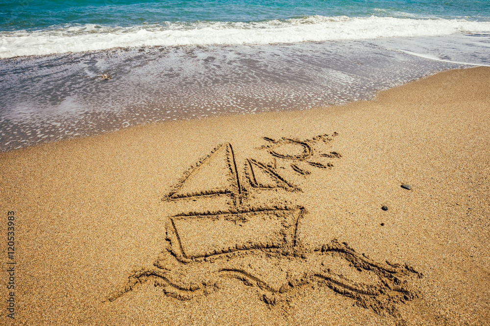 Fototapeta premium Ship painted on sand beach