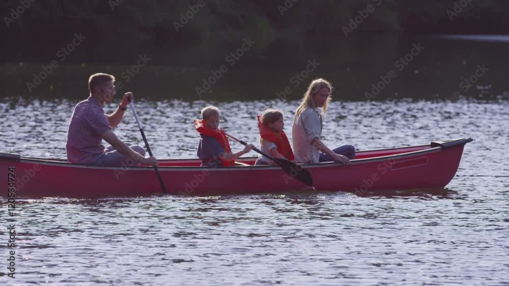 Family paddling canoe