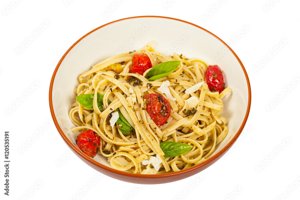 Pasta With Pesto and Roasted Tomatoes Isolated on White. Selective focus. Pasta With Pesto and Roasted Tomatoes Isolated on White. Selective focus.